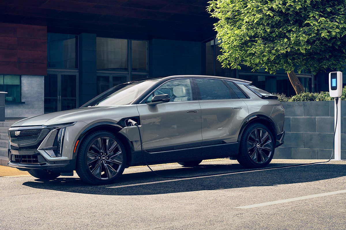 A Side Profile View of a Silver Cadillac LYRIQ Parked and Charging