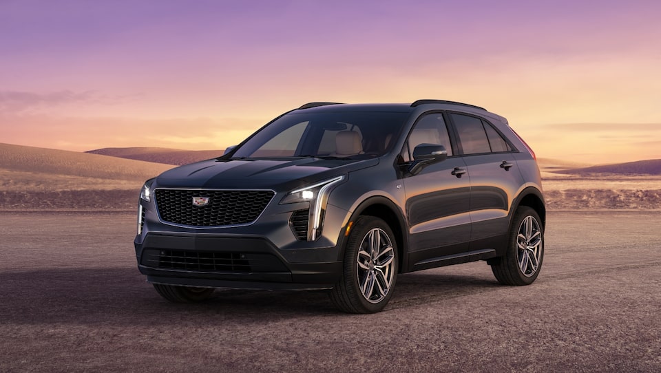 Cadillac SUV Parked on Gravel Path