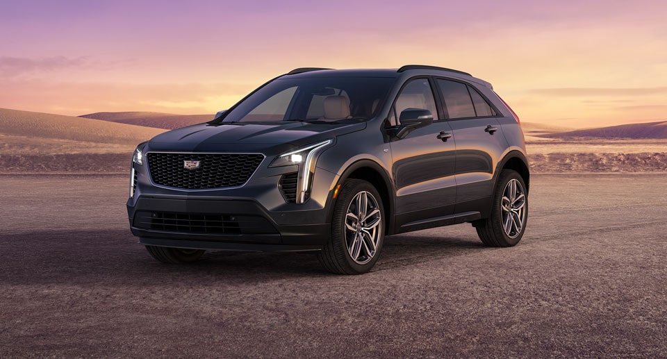 Cadillac SUV Parked on Gravel Path