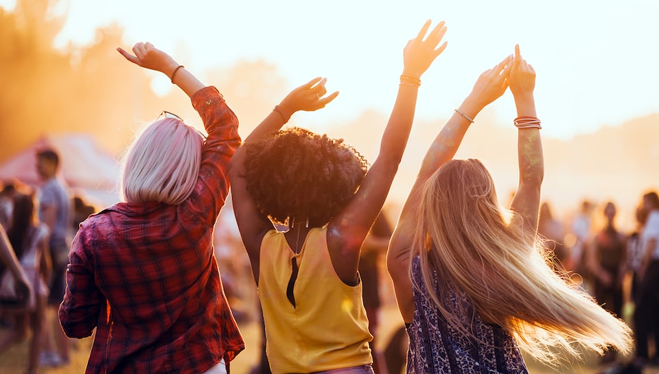 Women Dancing at Summer Outdoor Concert Festival When Using My Cadillac Rewards