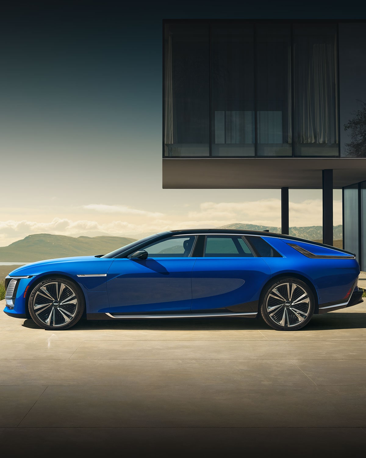 A Side Profile View of a Woman Walking to a Blue Cadillac CELESTIQ Parked by a Modern Home