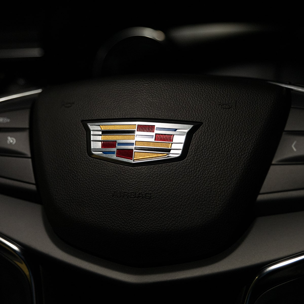 Close up of the Cadillac Logo on the 2025 XT5 Steering Wheel