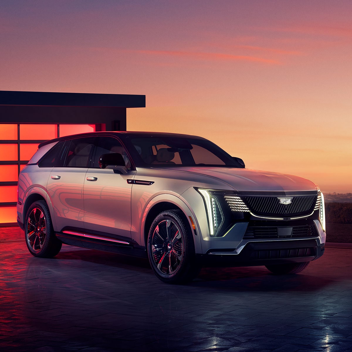 2025 Cadillac Escalade IQ Parked In Front of a Garage