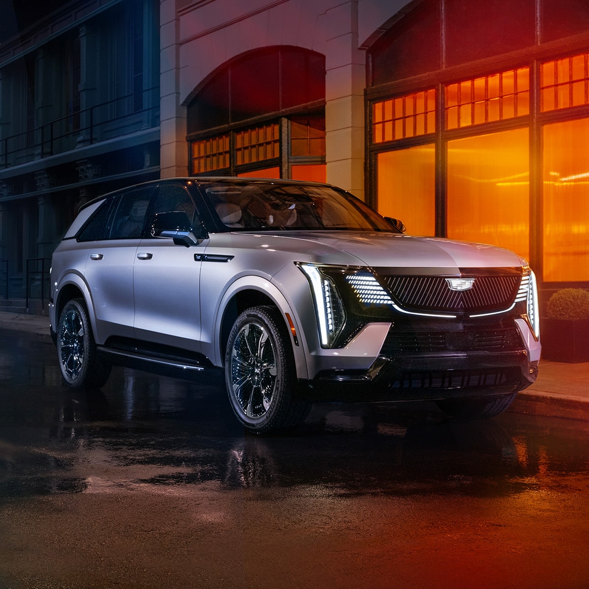 2025 Cadillac Escalade IQ Parked Outside a Restaurant at Night