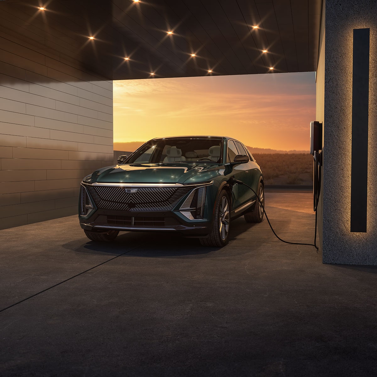 The Cadillac LYRIQ Parked in a Garage while Charging with a Gorgeous Sunset Backdrop