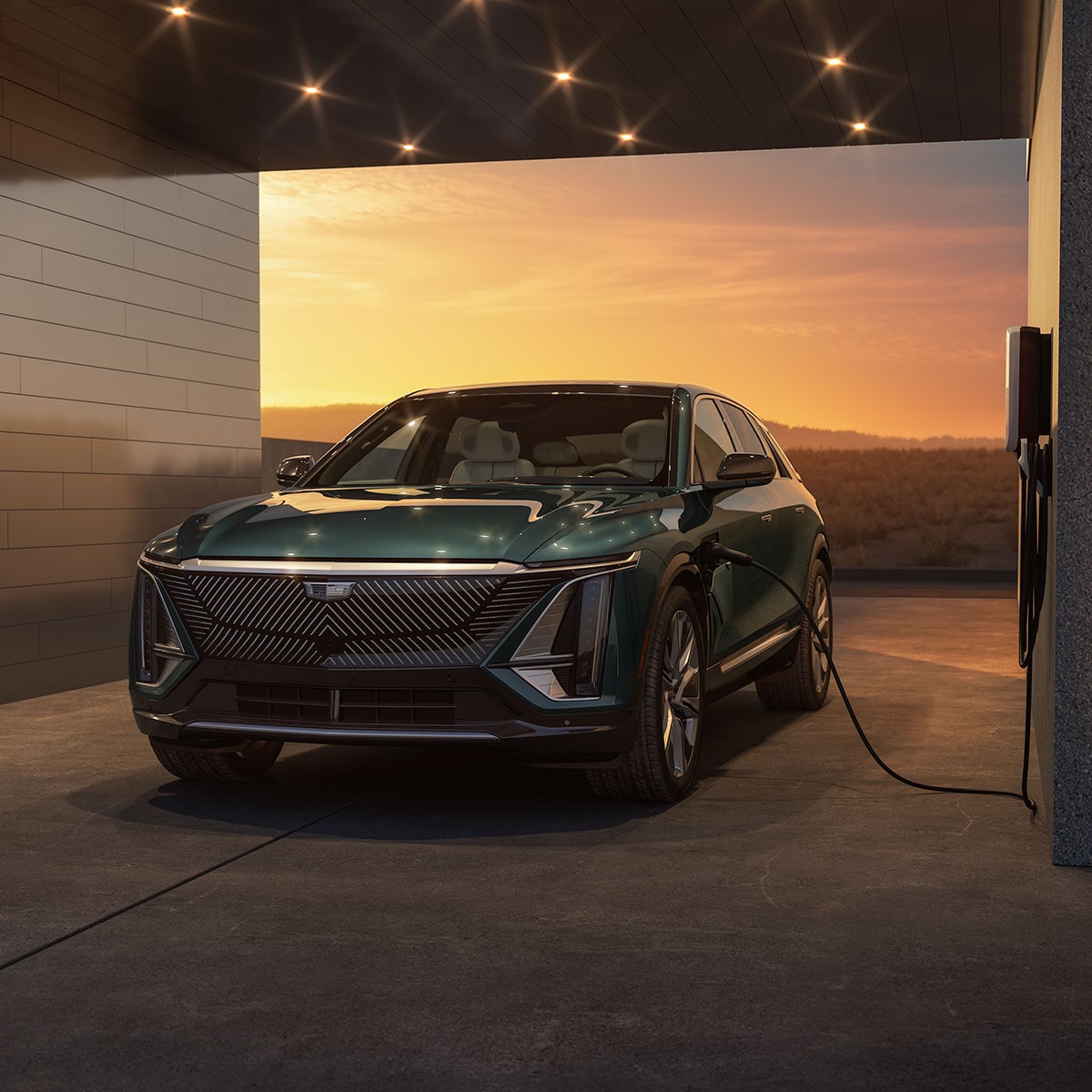 The Cadillac LYRIQ Parked in a Garage while Charging with a Gorgeous Sunset Backdrop