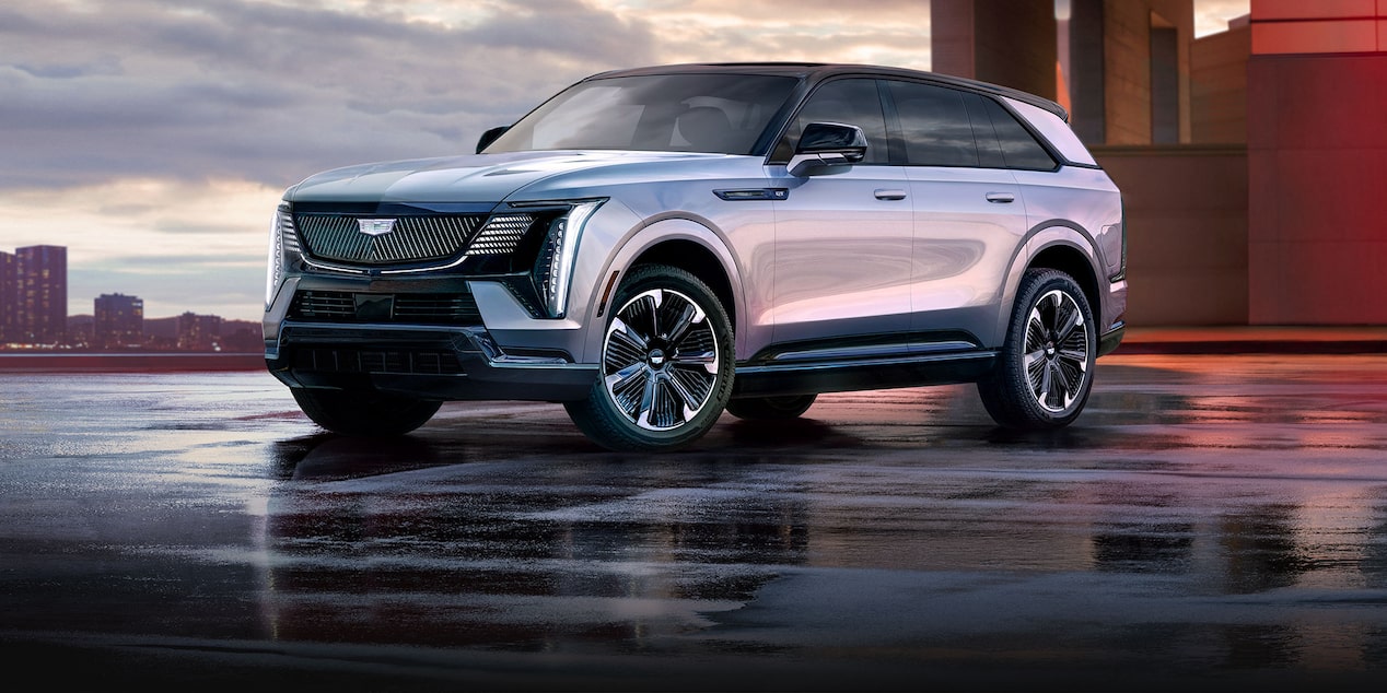 Three-quarter View of a 2025 Cadillac ESCALADE IQ Parked Outside Under an Overpass